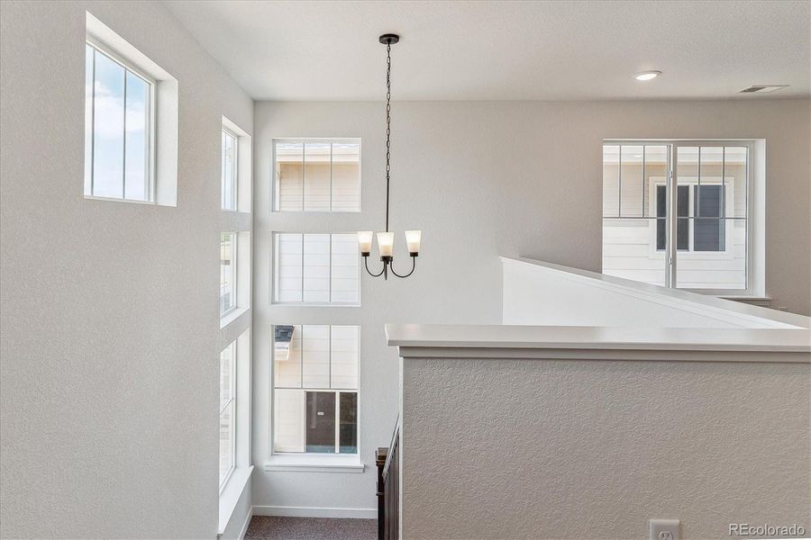 Furnished interior view inside a new home in Harvest Crossing, Aurora (Image 24).