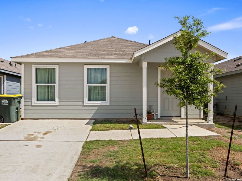 Front exterior of a new home in Rose Valley, Converse, TX, highlighting curb appeal (Image 24).