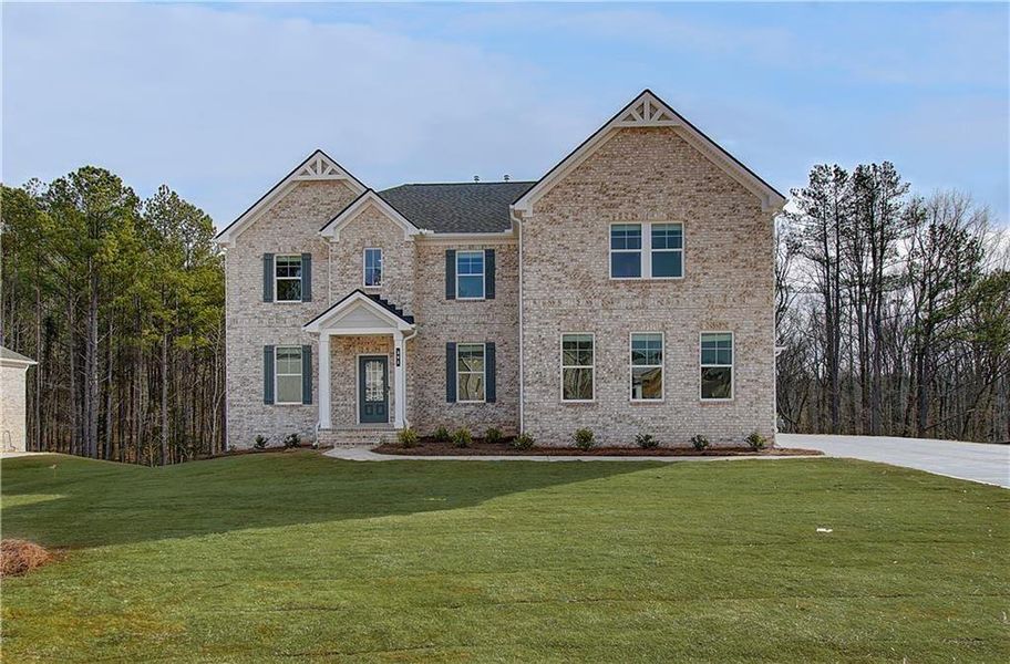 Front exterior of a new home in Trinity Park, McDonough, GA, highlighting curb appeal (Image 1). Front exterior of a new home in Trinity Park, McDonough, GA, highlighting curb appeal (Image 1).