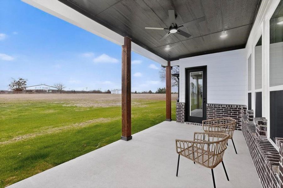 View of patio featuring ceiling fan and a view of rural / pastoral area View of patio featuring ceiling fan and a view of rural / pastoral area