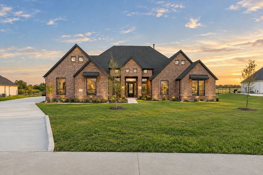 Front exterior of a new home in Berkshire Estates, Mesquite, TX, highlighting curb appeal (Image 2). Front exterior of a new home in Berkshire Estates, Mesquite, TX, highlighting curb appeal (Image 2).
