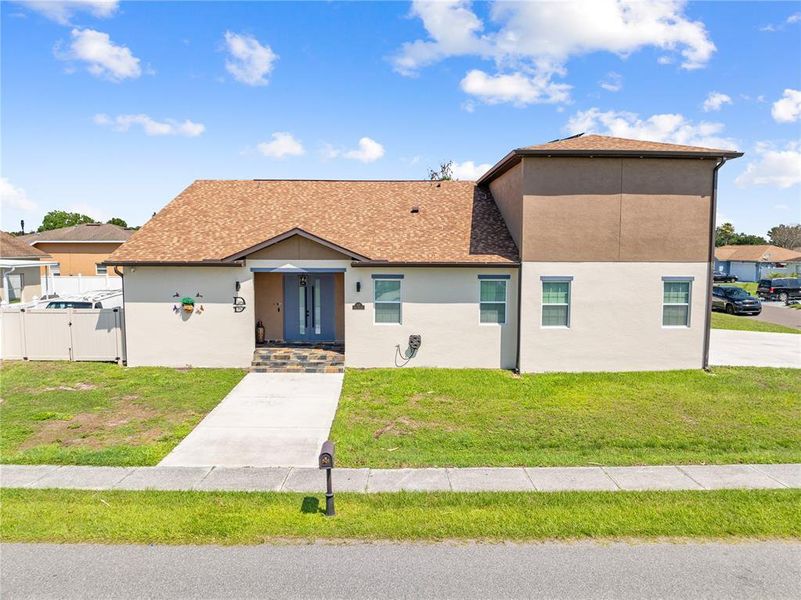 Front exterior of a new home in , Kissimmee, FL, highlighting curb appeal (Image 1). Front exterior of a new home in , Kissimmee, FL, highlighting curb appeal (Image 1).