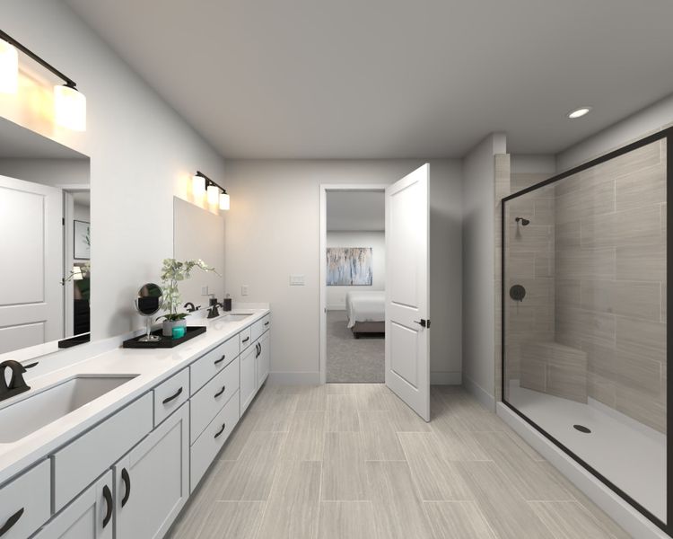 The primary bathroom offers dual vanity sinks and a walk-in shower. The primary bathroom offers dual vanity sinks and a walk-in shower.