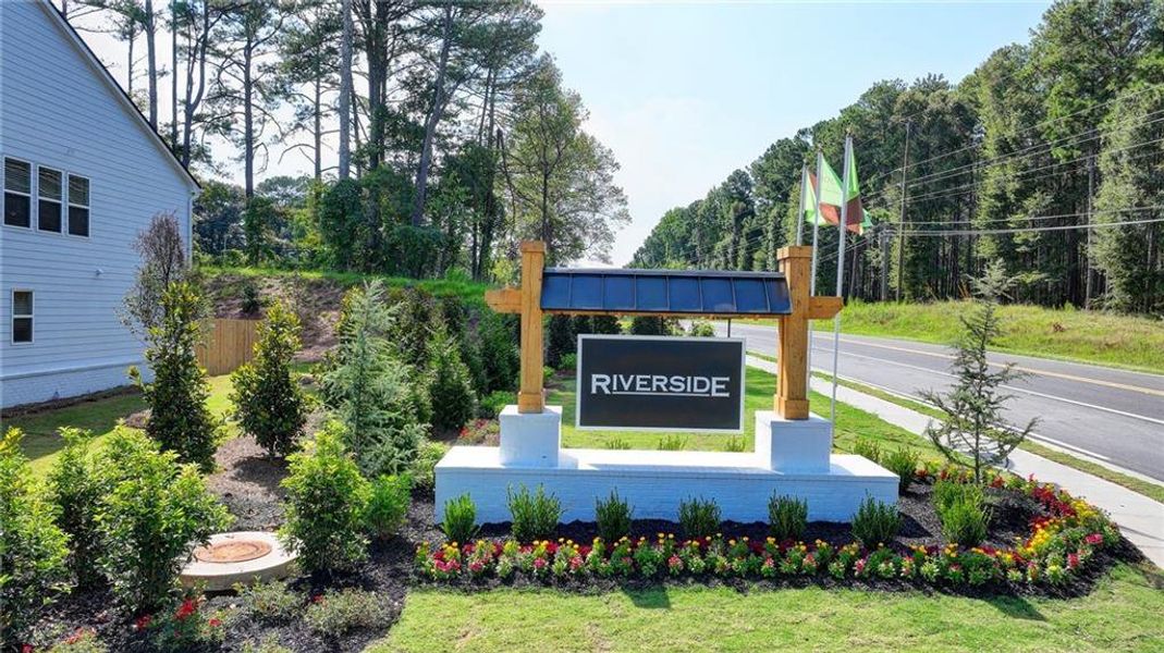 Entrance to the Riverside community in Conyers, GA, featuring signage and landscaping (Image 1).