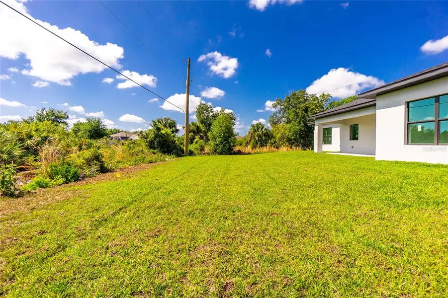 Exterior details and patio area of a home in , Port Charlotte (Image 36).