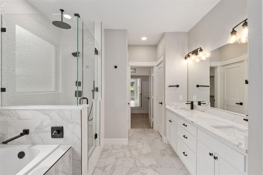 Primary bath with separate shower, double sink and private water closet Primary bath with separate shower, double sink and private water closet