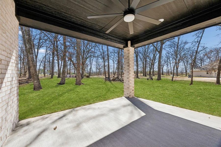 Covered back patio with ceiling fan