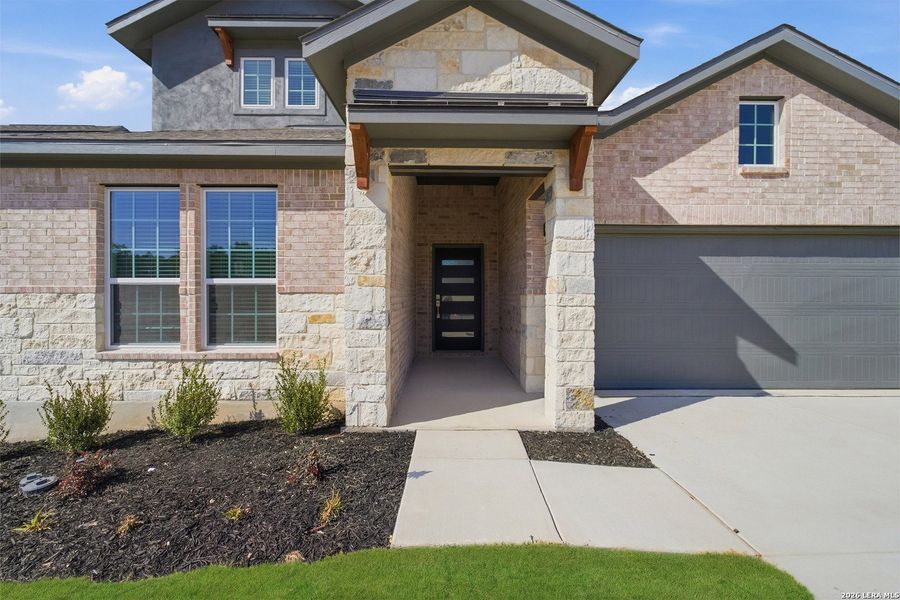 Exterior details and patio area of a home in The Woodlands at Medina Hills, Mico (Image 4).