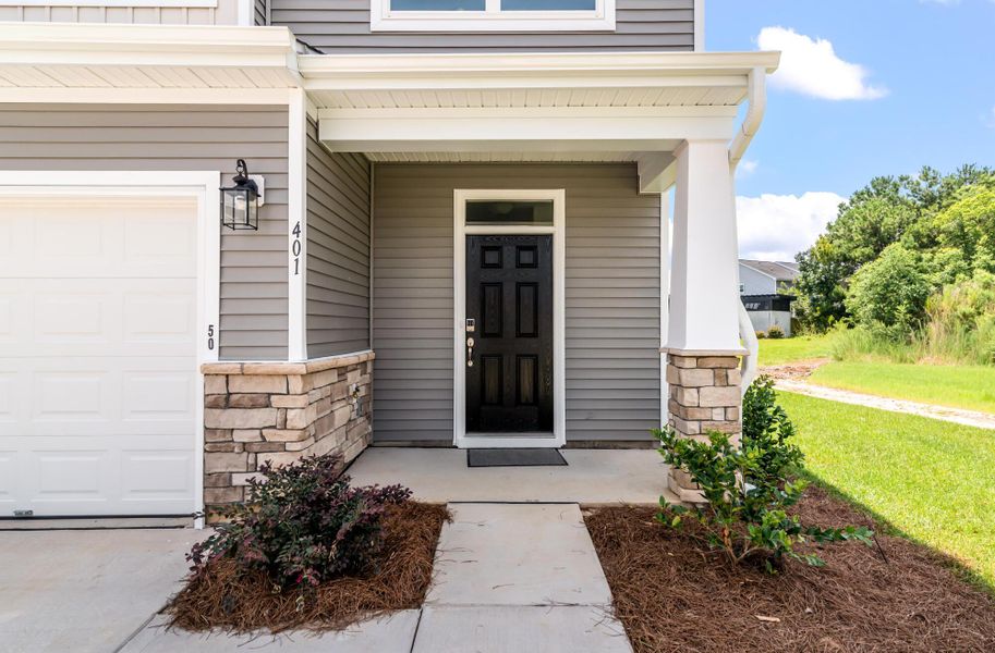 Exterior details and patio area of a home in The Landings at Montague, Goose Creek (Image 2). Exterior details and patio area of a home in The Landings at Montague, Goose Creek (Image 2).