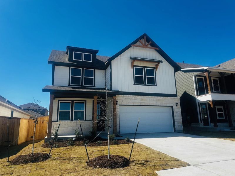 Front exterior of a new home in Patterson Ranch, Georgetown, TX, highlighting curb appeal (Image 22). Front exterior of a new home in Patterson Ranch, Georgetown, TX, highlighting curb appeal (Image 22).