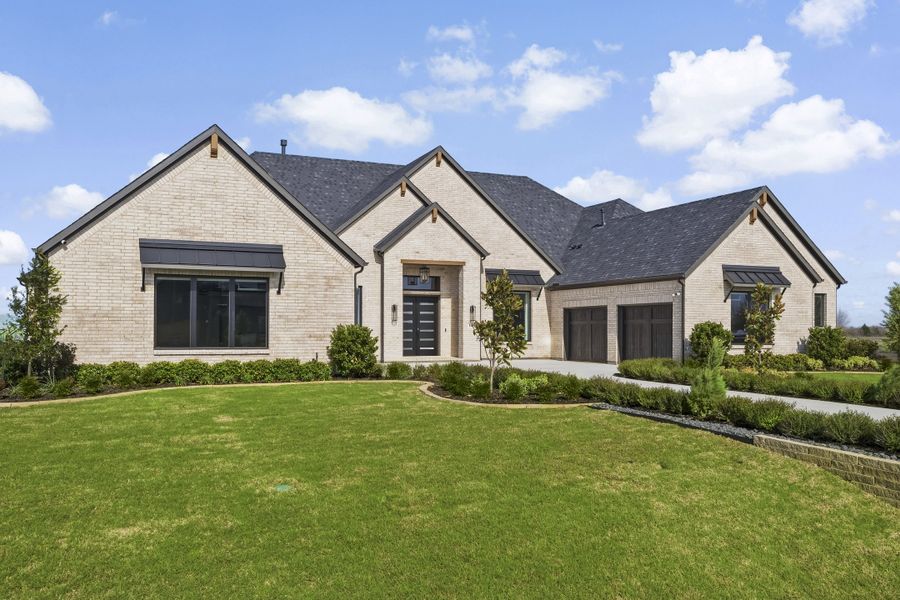 Front exterior of a new home in Ridge Pointe Estates, McLendon-Chisholm, TX, highlighting curb appeal (Image 27). Front exterior of a new home in Ridge Pointe Estates, McLendon-Chisholm, TX, highlighting curb appeal (Image 27).