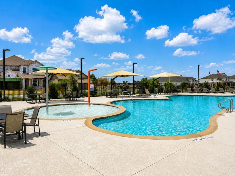 A spacious community pool offers ample recreation under the broad, open sky.