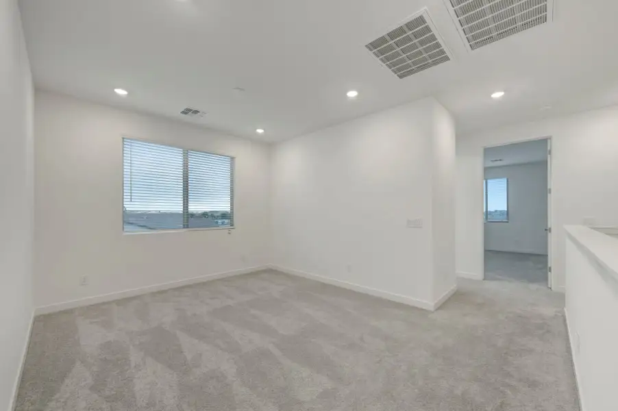 Spacious, unfurnished interior of a new home in Soleo, San Tan Valley (Image 38).