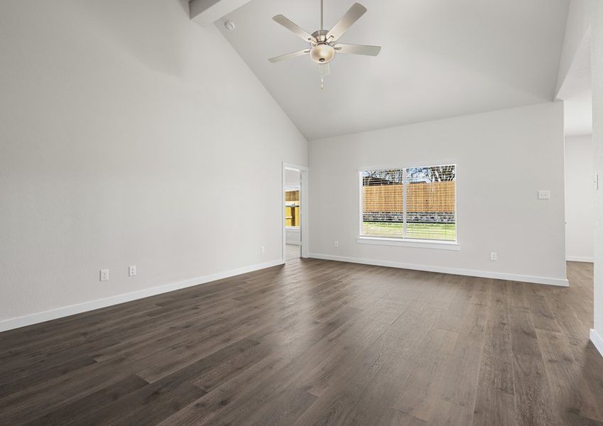 The living room has a large window that lets in great, natural light.