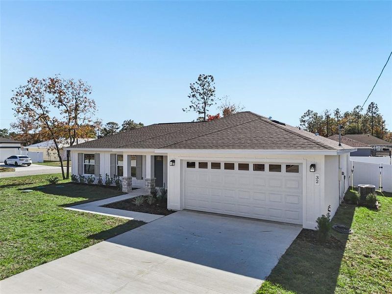 Front exterior of a new home in , Ocala, FL, highlighting curb appeal (Image 1). Front exterior of a new home in , Ocala, FL, highlighting curb appeal (Image 1).