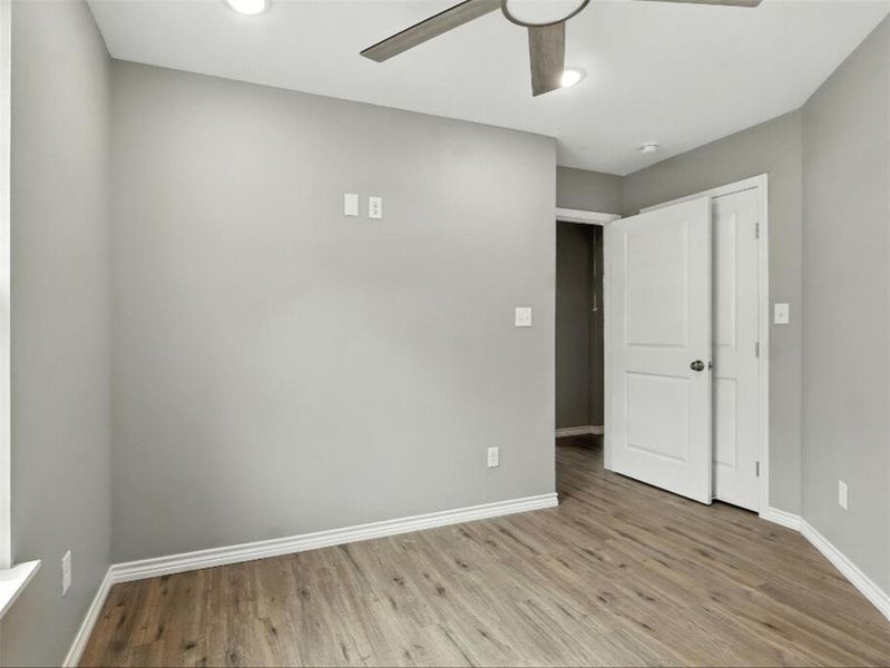 Unfurnished bedroom featuring light wood finished floors and ceiling fan Unfurnished bedroom featuring light wood finished floors and ceiling fan