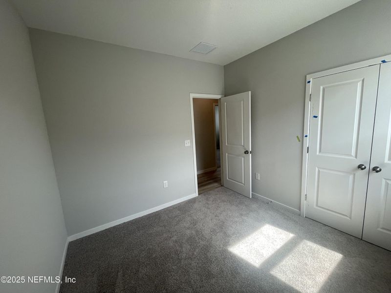 Spacious, unfurnished interior of a new home in Palm Series at Seminole Palms, Palm Coast (Image 34).