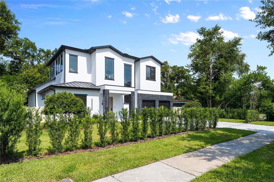 Front exterior of a new home in , Winter Park, FL, highlighting curb appeal (Image 24). Front exterior of a new home in , Winter Park, FL, highlighting curb appeal (Image 24).