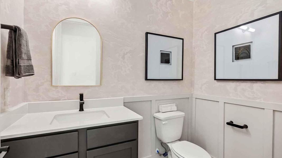 The decorate half bathroom downstairs for visiting guests