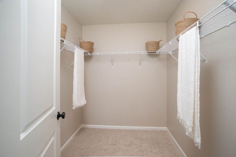 Large walk-in closet at primary suite