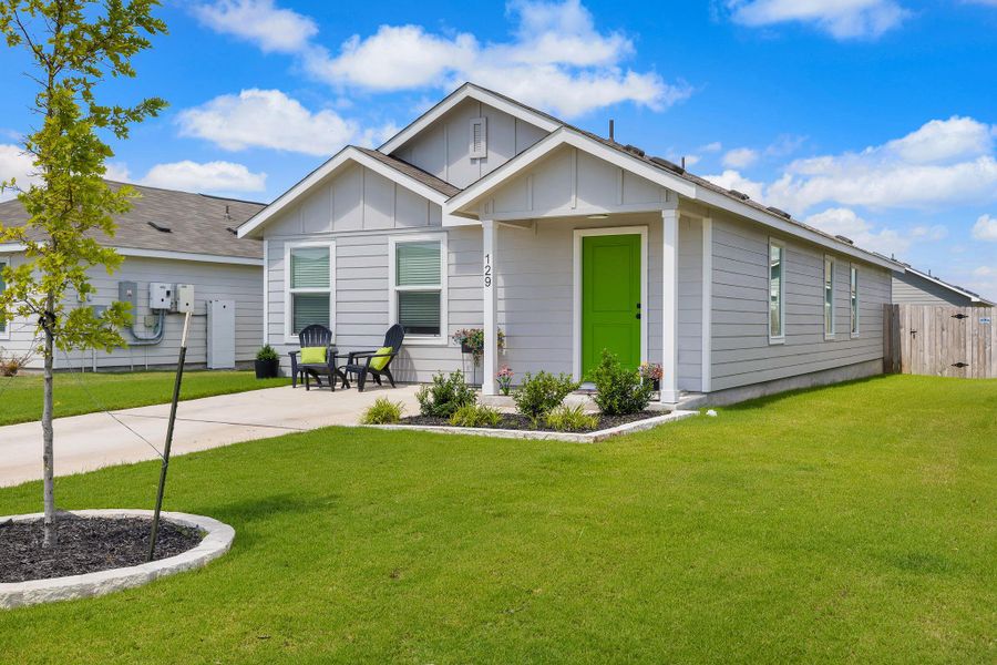 Front exterior of a new home in Rancho Del Cielo, Jarrell, TX, highlighting curb appeal (Image 2). Front exterior of a new home in Rancho Del Cielo, Jarrell, TX, highlighting curb appeal (Image 2).