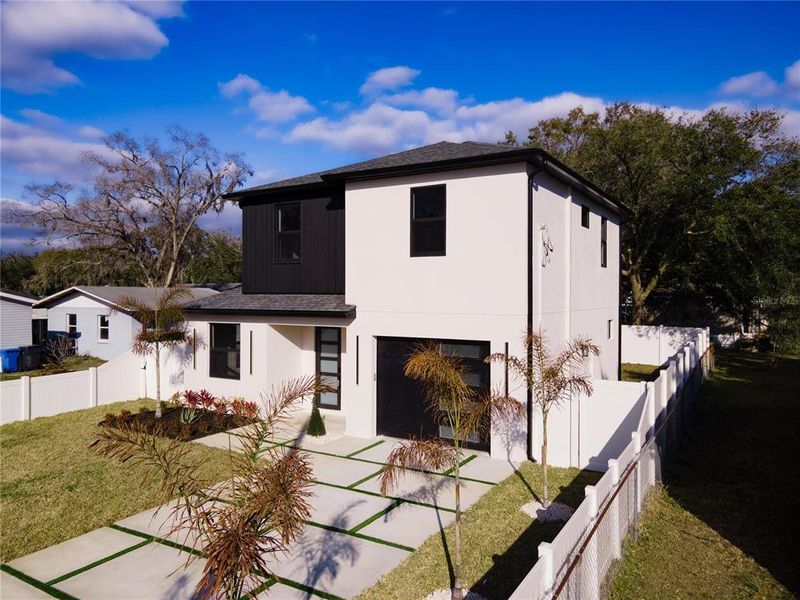 Front exterior of a new home in , Tampa, FL, highlighting curb appeal (Image 24).