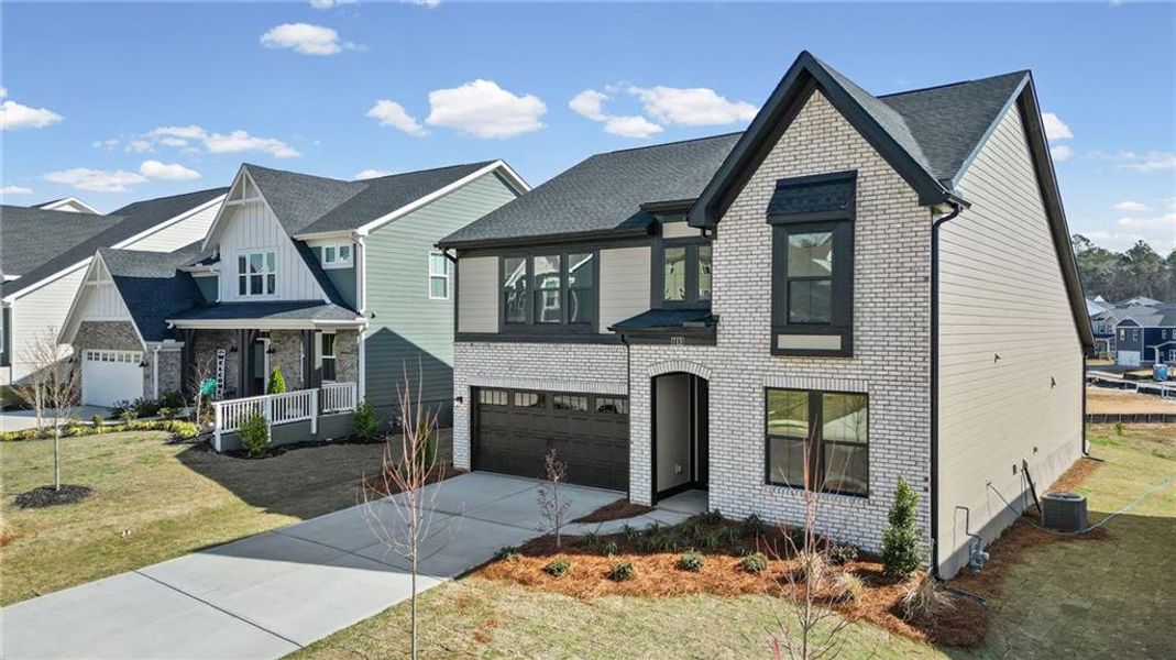 Front exterior of a new home in Twin Lakes, Hoschton, GA, highlighting curb appeal (Image 25).