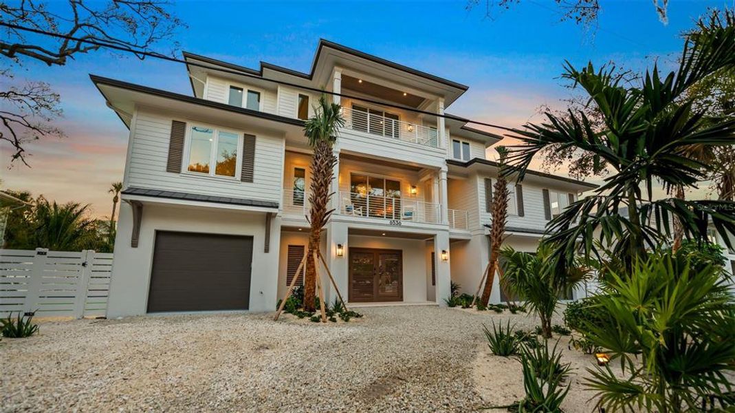 Front exterior of a new home in , Sarasota, FL, highlighting curb appeal (Image 22). Front exterior of a new home in , Sarasota, FL, highlighting curb appeal (Image 22).