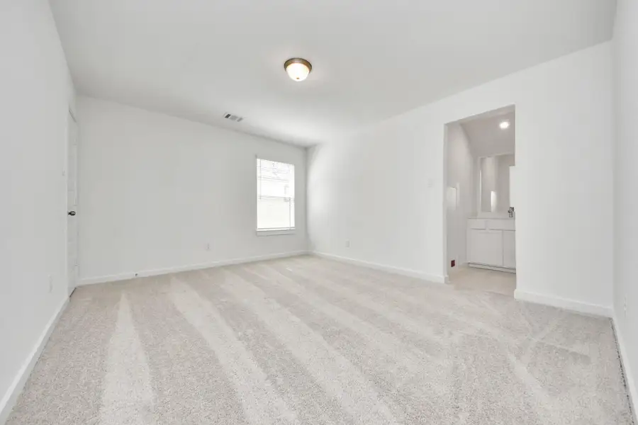 Generously sized secondary bedrooms featuring spacious closets, soft and inviting carpeting underfoot, large windows allowing plenty of natural light, and the added touch of privacy blinds for your personal retreat.