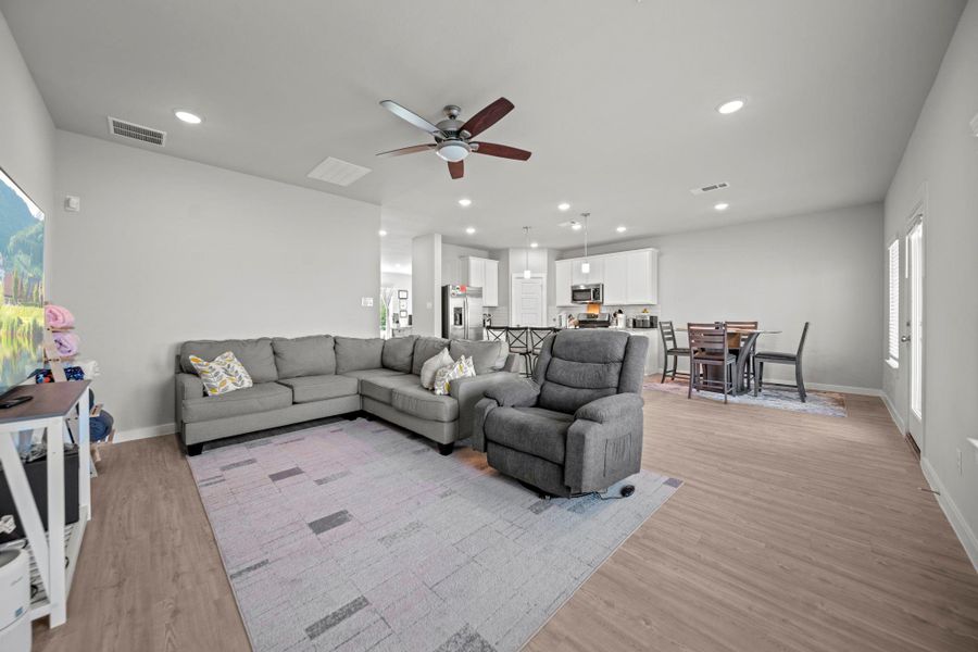 the kitchen is open to the living room and the breakfast nook, which is perfect for family gathering the kitchen is open to the living room and the breakfast nook, which is perfect for family gathering