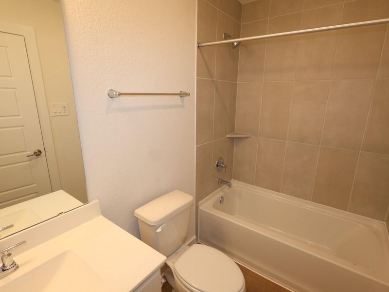 Furnished interior view inside a new home in Sorella, Tomball (Image 14).