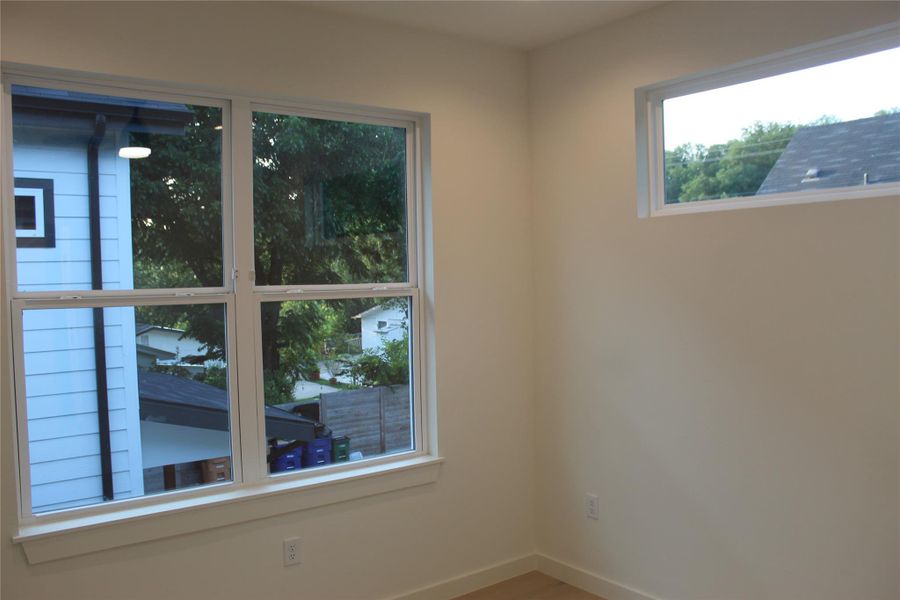 Ample windows invite natural illumination into this welcoming interior space.