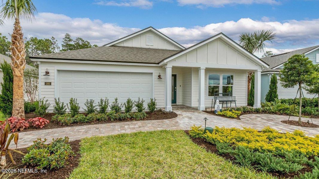 Front exterior of a new home in Sawmill Branch, Palm Coast, FL, highlighting curb appeal (Image 25).