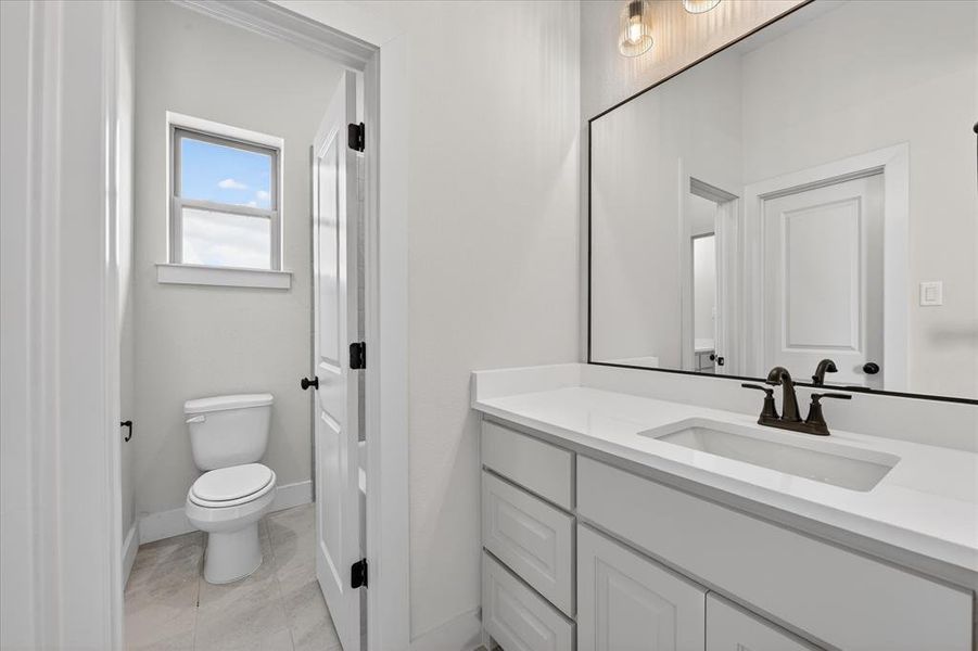 Bathroom featuring toilet and vanity