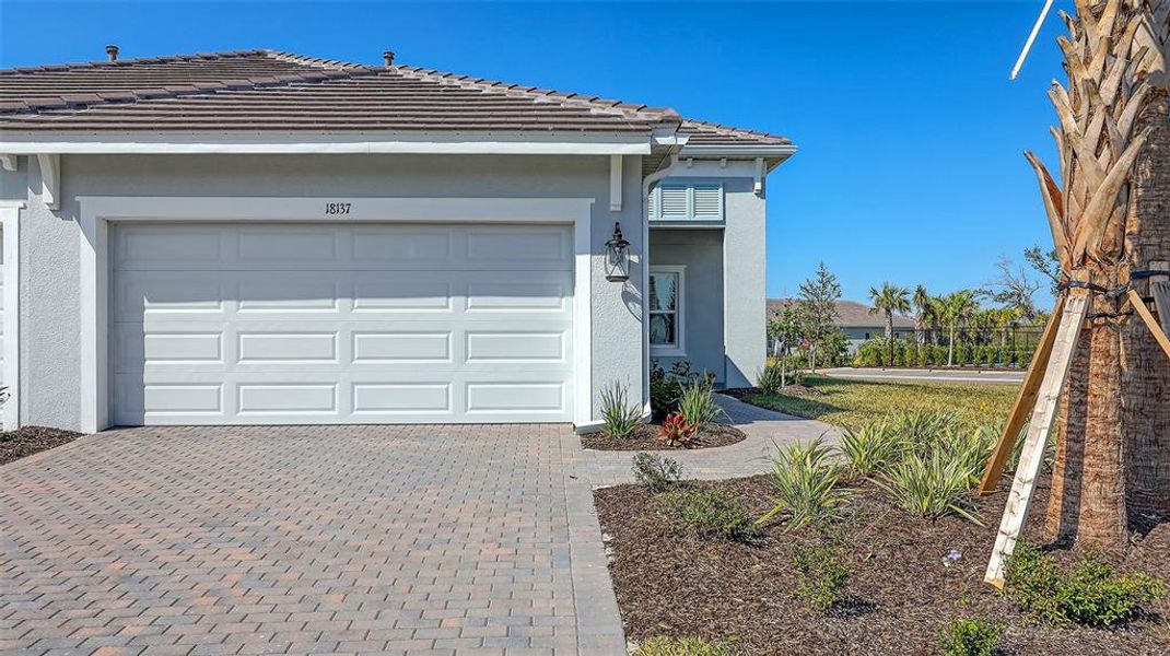 Front exterior of a new home in , Venice, FL, highlighting curb appeal (Image 2).
