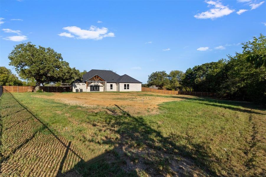 View of fenced backyard