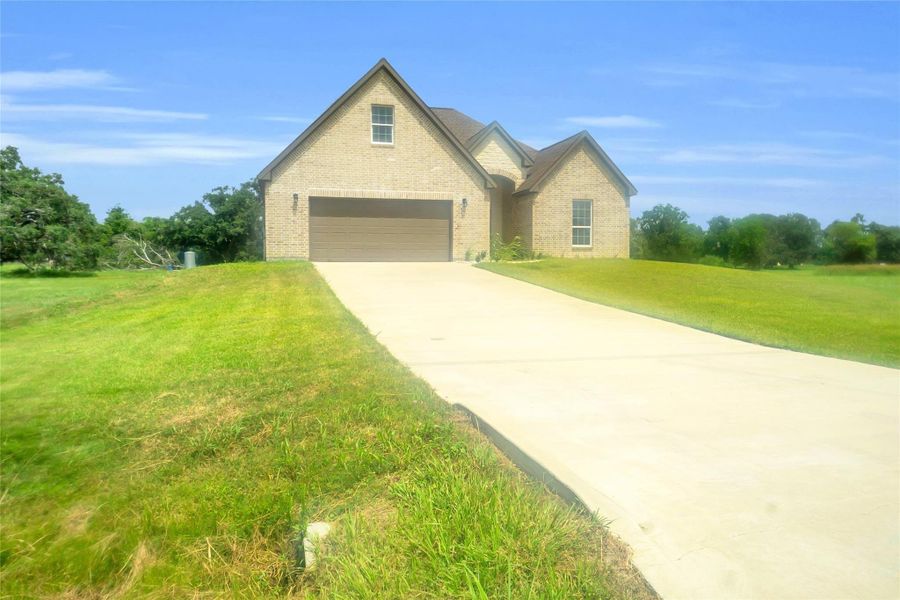 Front exterior of a new home in , Angleton, TX, highlighting curb appeal (Image 11). Front exterior of a new home in , Angleton, TX, highlighting curb appeal (Image 11).