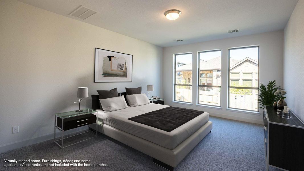 Bedroom with carpet flooring and baseboards Bedroom with carpet flooring and baseboards