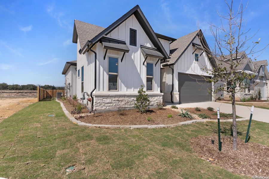 Front exterior of a new home in Davis Ranch, San Antonio, TX, highlighting curb appeal (Image 19).