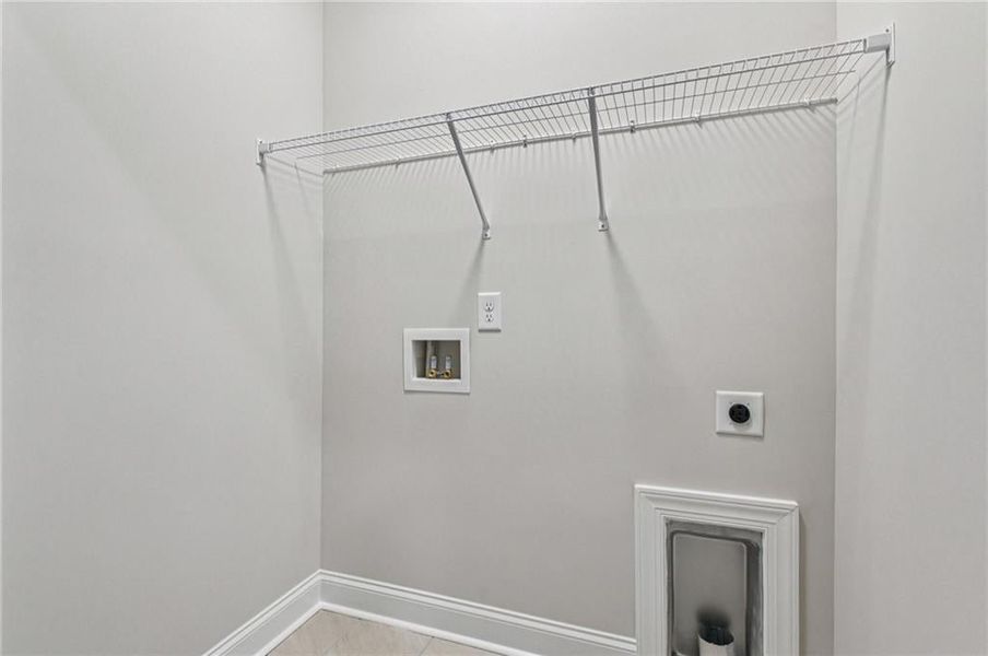 Laundry area with electric dryer hookup and hookup for a washing machine