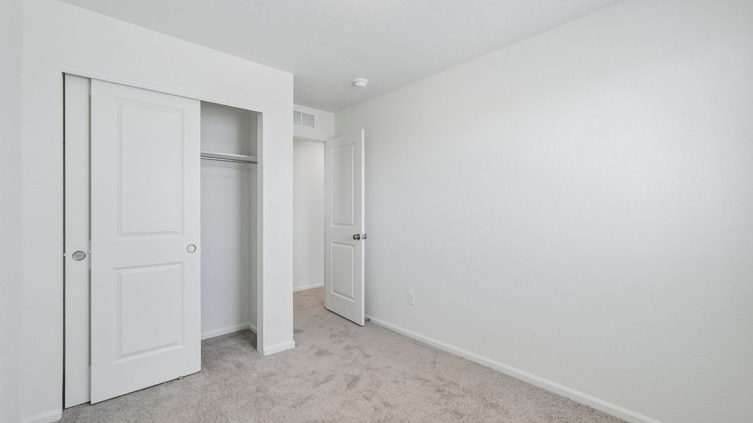 Spacious, unfurnished interior of a new home in Banning Lewis Ranch, Colorado Springs (Image 25).