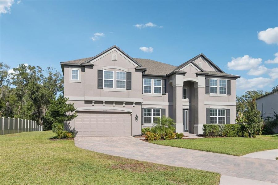 Front exterior of a new home in Talavera, Spring Hill, FL, highlighting curb appeal (Image 1). Front exterior of a new home in Talavera, Spring Hill, FL, highlighting curb appeal (Image 1).
