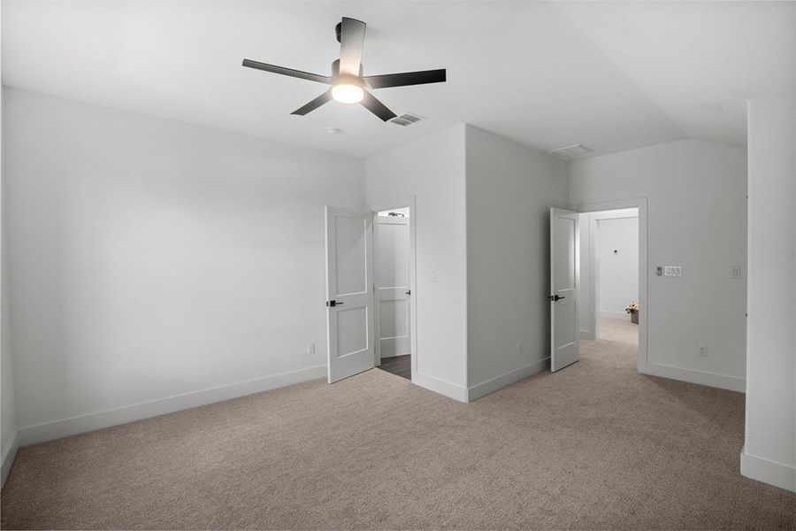 Unfurnished bedroom featuring carpet flooring, baseboards, and a ceiling fan Unfurnished bedroom featuring carpet flooring, baseboards, and a ceiling fan