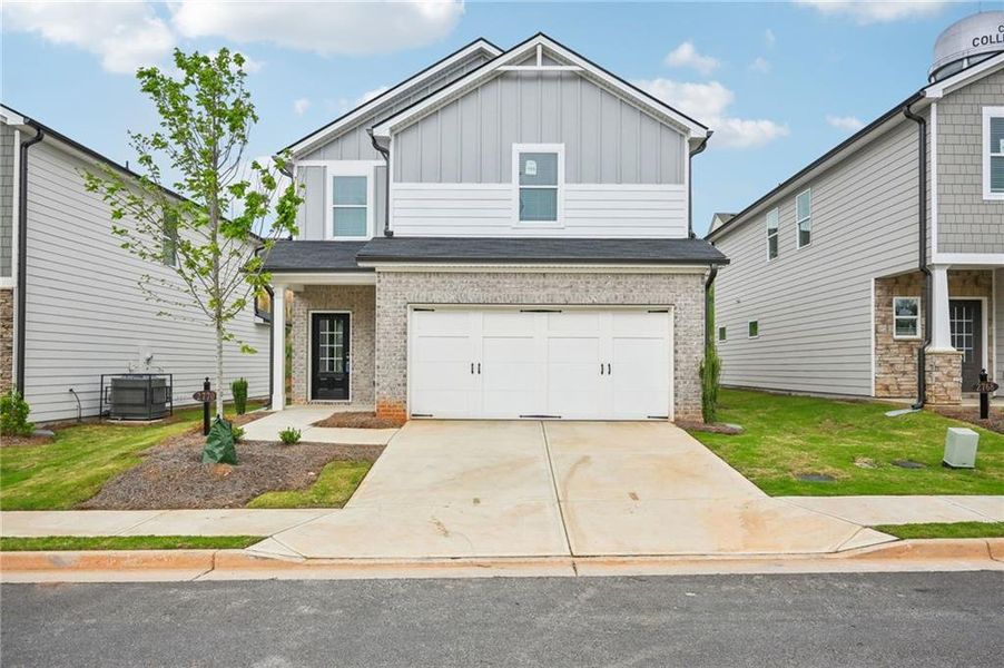 Front exterior of a new home in Hawthorne Station, College Park, GA, highlighting curb appeal (Image 25).