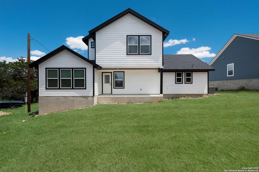 Exterior details and patio area of a home in , Lakehills (Image 2).