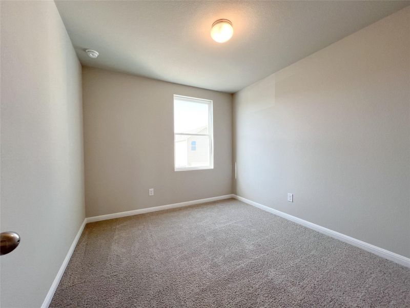 Spare room with baseboards and carpet floors Spare room with baseboards and carpet floors