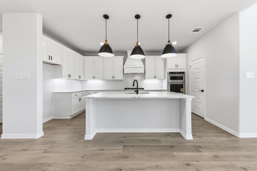 No shortage of style, storage or prep space in this wonderful kitchen!