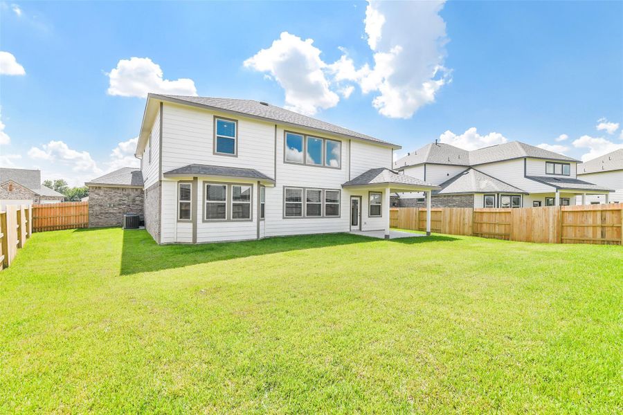 Front exterior of a new home in Stone Creek Ranch, Hockley, TX, highlighting curb appeal (Image 2). Front exterior of a new home in Stone Creek Ranch, Hockley, TX, highlighting curb appeal (Image 2).