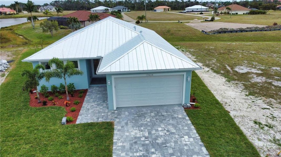Front exterior of a new home in , Punta Gorda, FL, highlighting curb appeal (Image 2). Front exterior of a new home in , Punta Gorda, FL, highlighting curb appeal (Image 2).