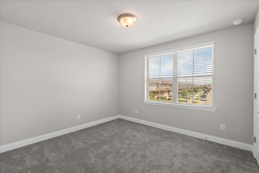 Spacious, unfurnished interior of a new home in Sunterra, Katy (Image 28).